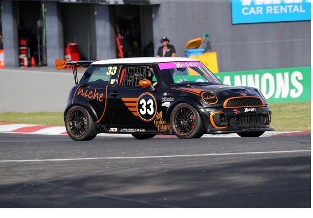 Number 33 cornering at speed at Mount Panorama